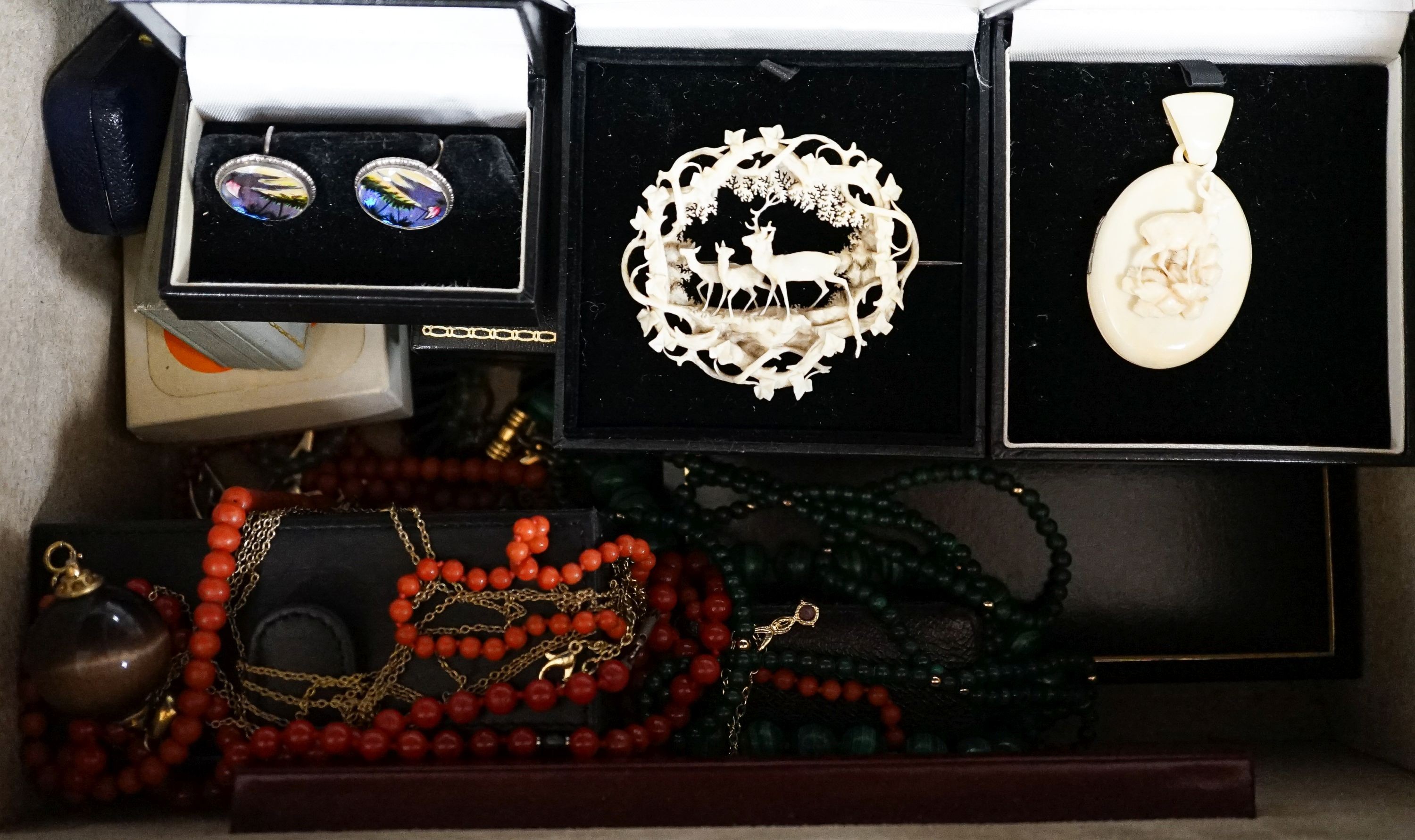 A quantity of costume jewellery in two cases.